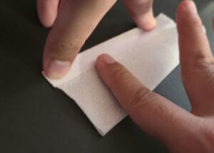 Tapering the bottom of the t-tape to adhere them.