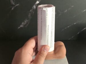 Putting a roll of paper on your erect penis to measure the opening diameter