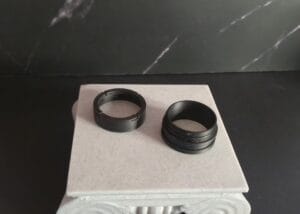 Unassembled T-Tape Topper. Two parts: The lid and the base
