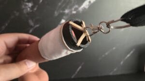 Tugger claw clip attached to topper rubberband intersection